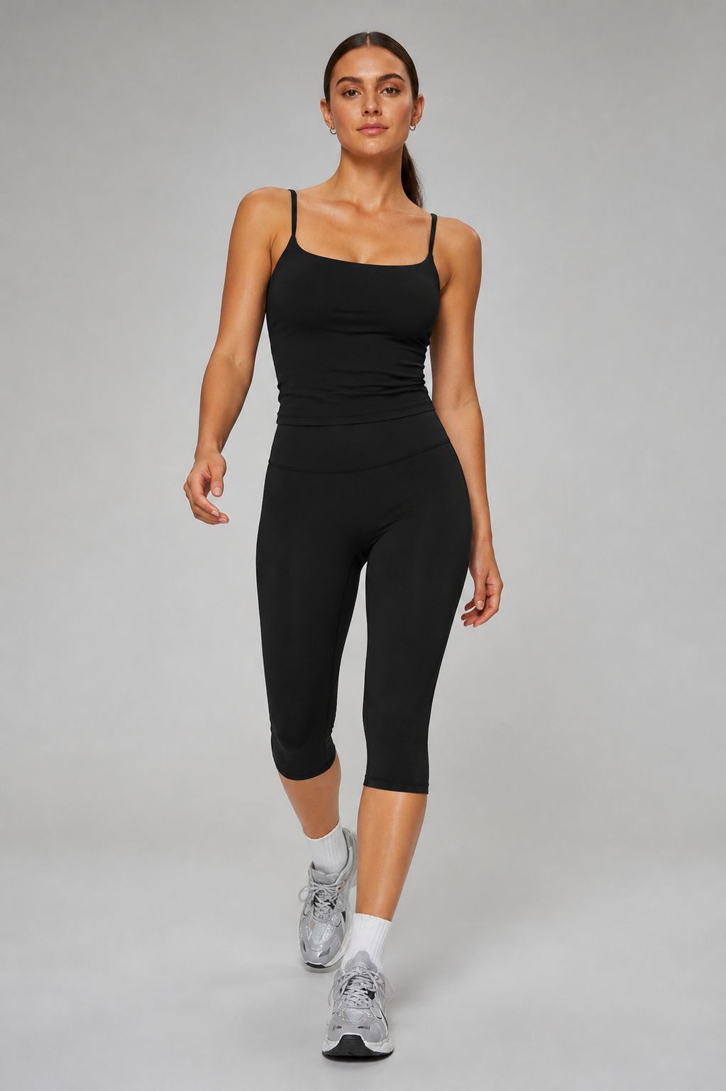 Aura Sculpt Capri Leggings in Jet Black — model view 1 | color:jet black