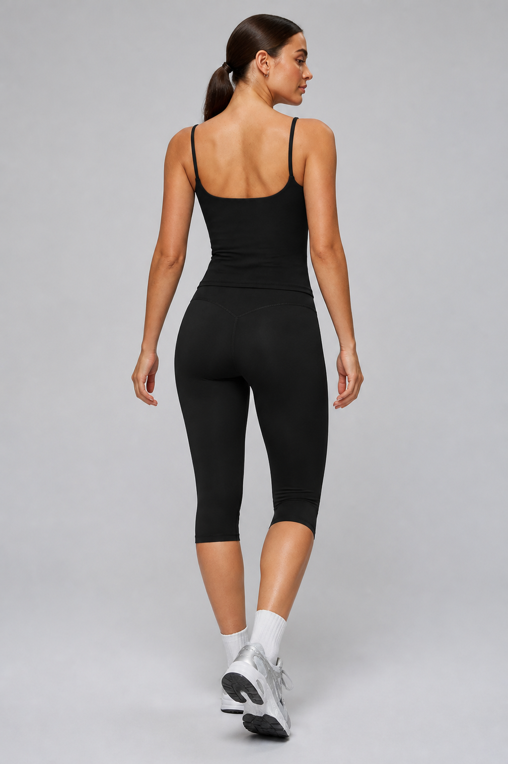 Aura Sculpt Capri Leggings in Jet Black — model view 3 | color:jet black