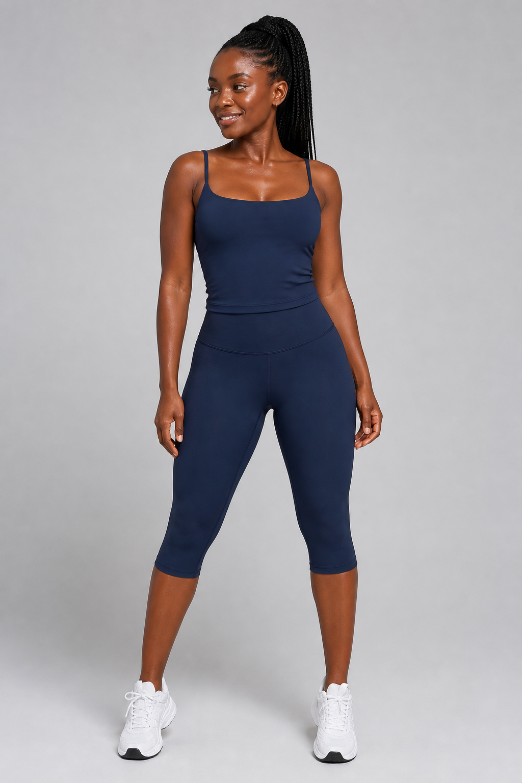 Aura Sculpt Capri Leggings in Navy Blue — model view 1 | color:navy blue
