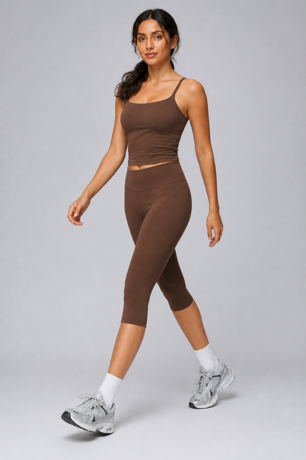 Aura Sculpt Capri Leggings in Chocolate Brown — model view 1 | color:chocolate