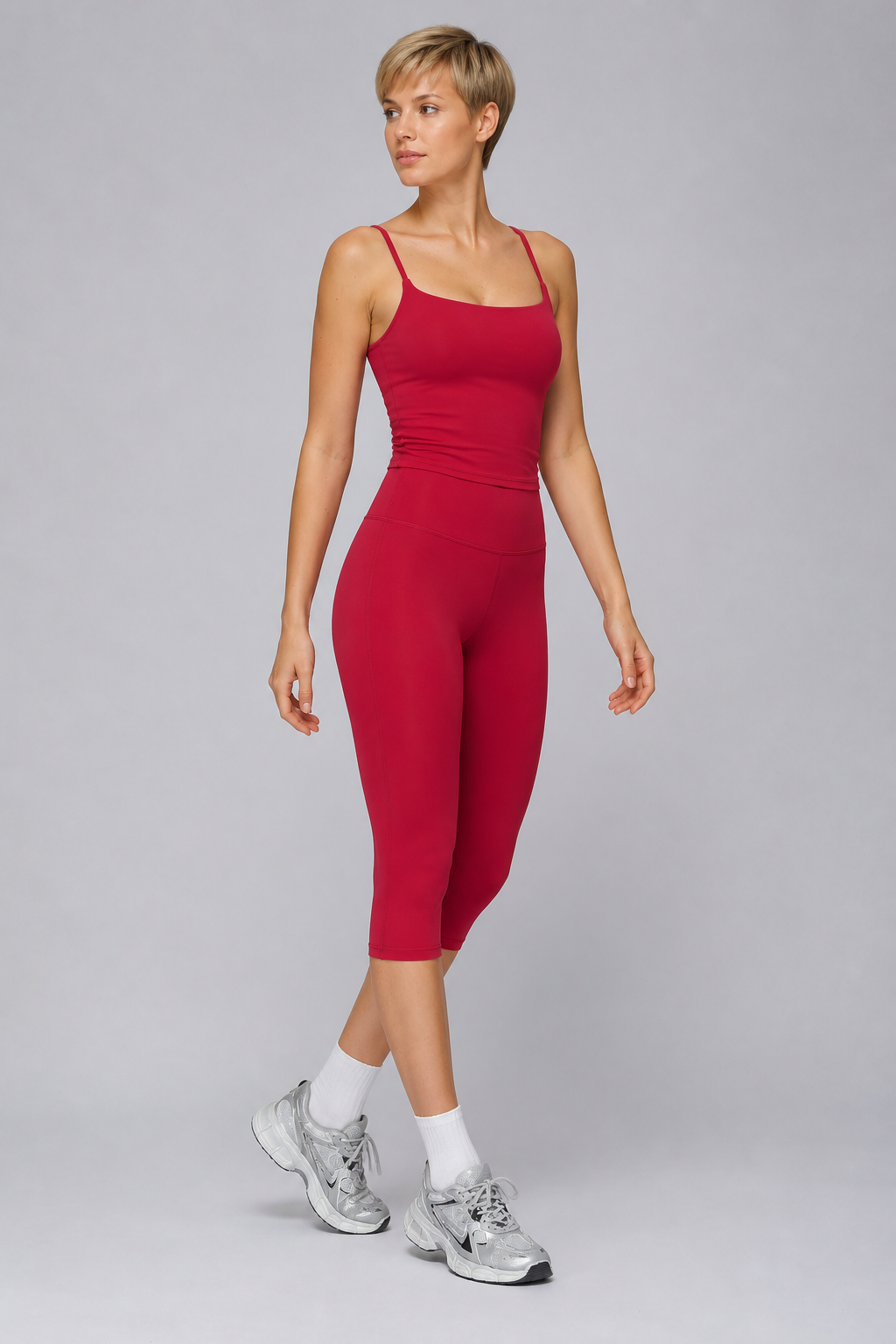 Aura Sculpt Capri Leggings in Crimson — model view 1 | color:berry